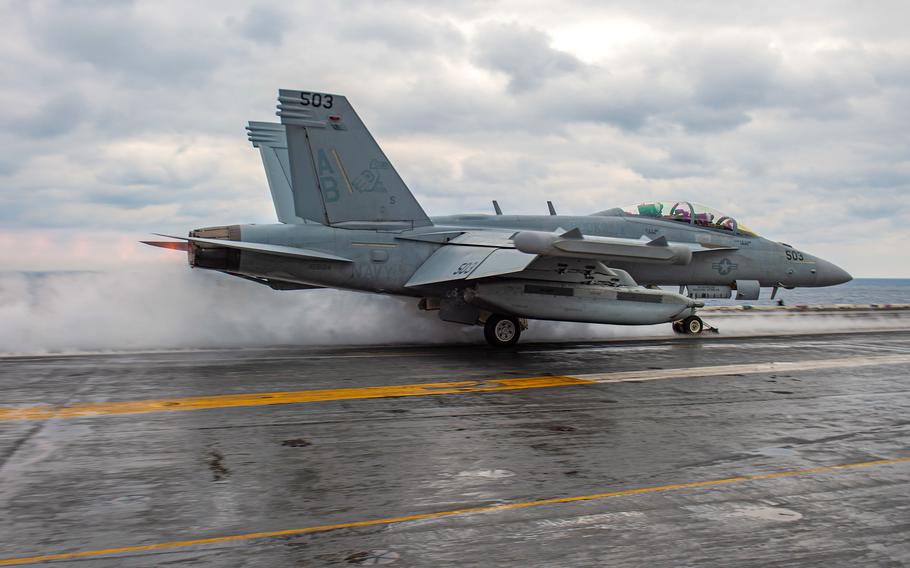 An EA-18G Growler, attached to the “Rooks” of Electronic Attack Squadron 137, launches from the flight deck of the  aircraft carrier USS Harry S. Truman in the Aegean Sea on March 5, 2022. Cmdr. Matthew McCormick was relieved of duty as commander of the Rooks on June 8, 2022, the Navy said in a statement.