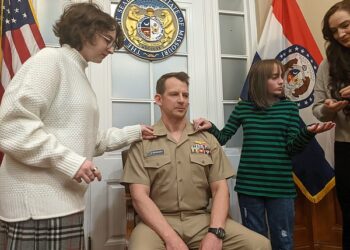 U.S. Navy officer celebrates new rank with friends, family