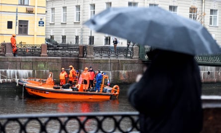 Russian police investigators as they conduct searches on the Moika in Saint Petersburg on Sunday.