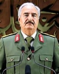 man in uniform in front of two microphones