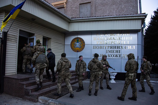 Ukrainian soldiers arrive at their barracks in Kharkiv.